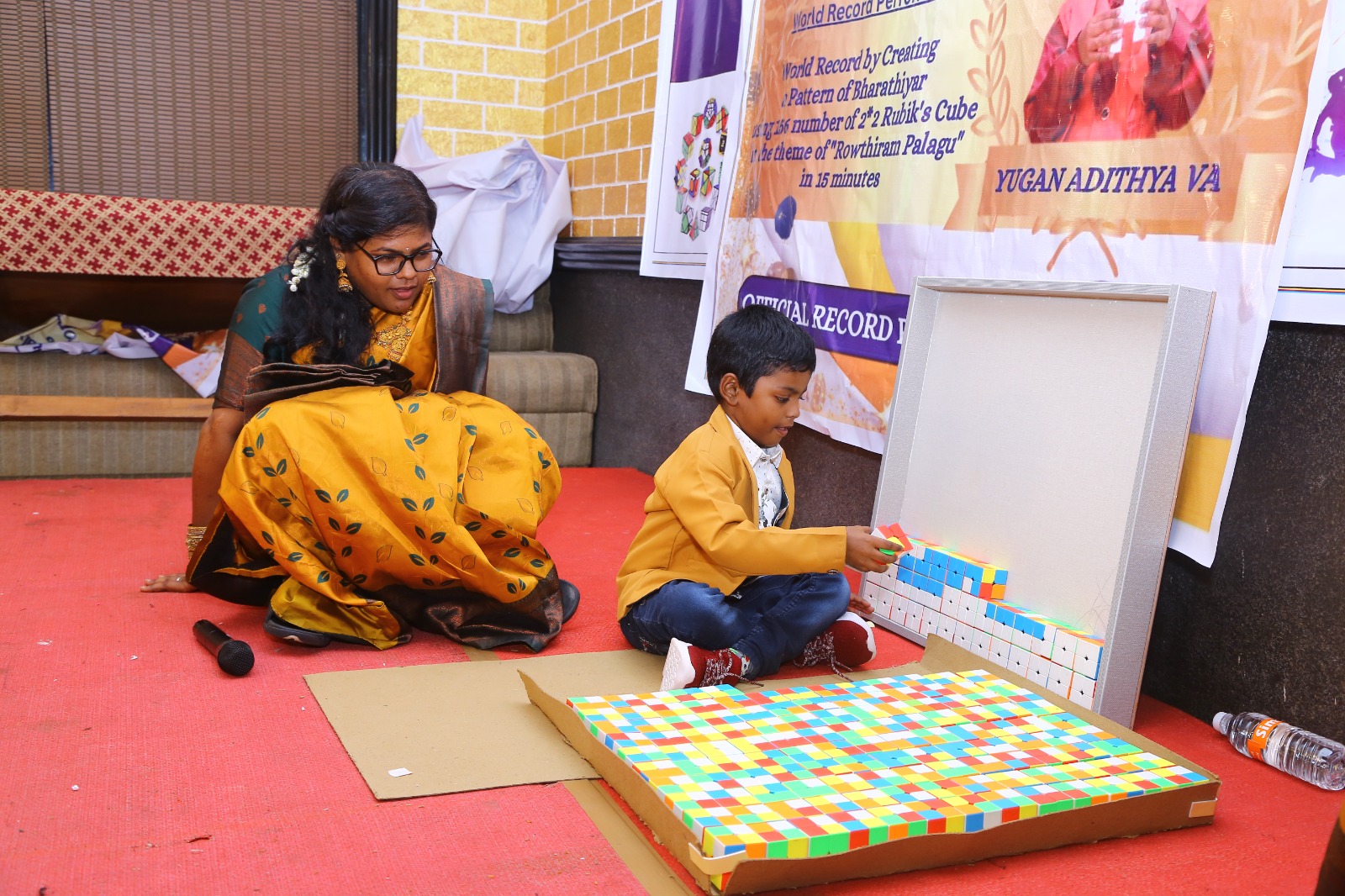 World record by arranging 156 number of 2*2 Rubik's Cube in the   formation of Bharathiyar 's face under the theme of "ROWTHIRAM PAZHAGU"  by reciting Bharathiyar 's Puthiya Aathichudi SIMULTANEOUSLy in least time.